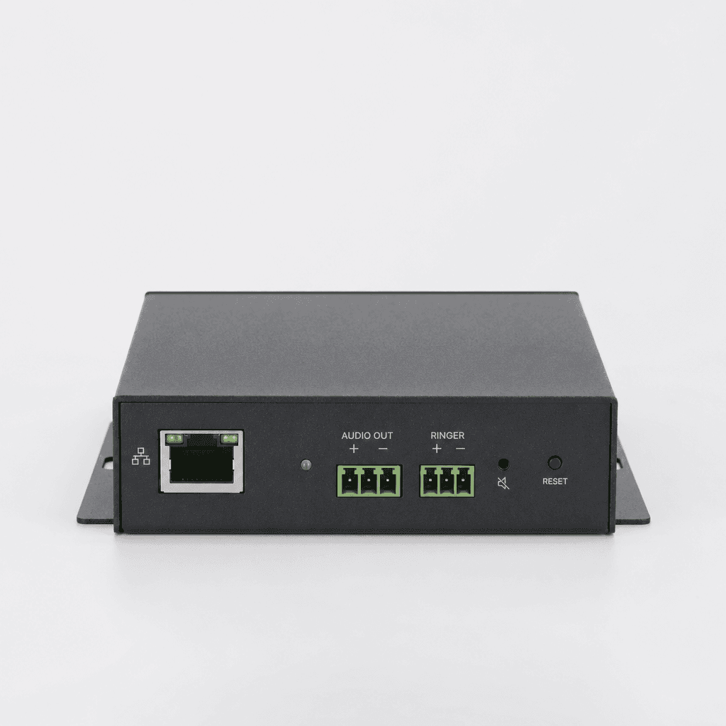 Technician connecting a network cable to a VoIP adapter