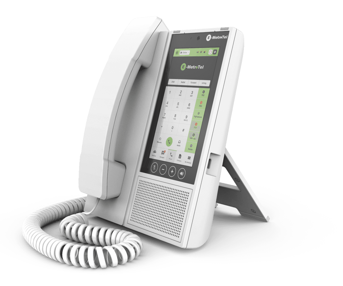 White E-MetroTel desk phone with a large touchscreen display and a coiled handset cord.